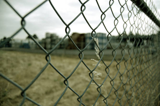 istock Chain Link Fence - metal chainlink fence 868752452
