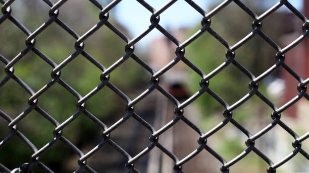 istock Chain Link Fence - metal chainlink fence 868752462