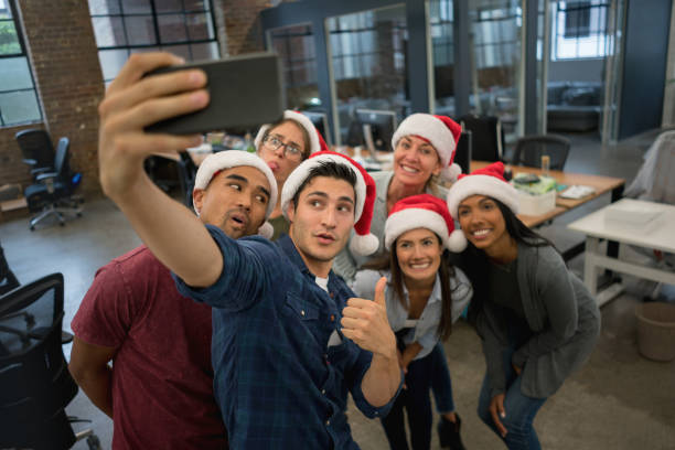 istock Creative office celebrating Christmas and taking a selfie 868752862