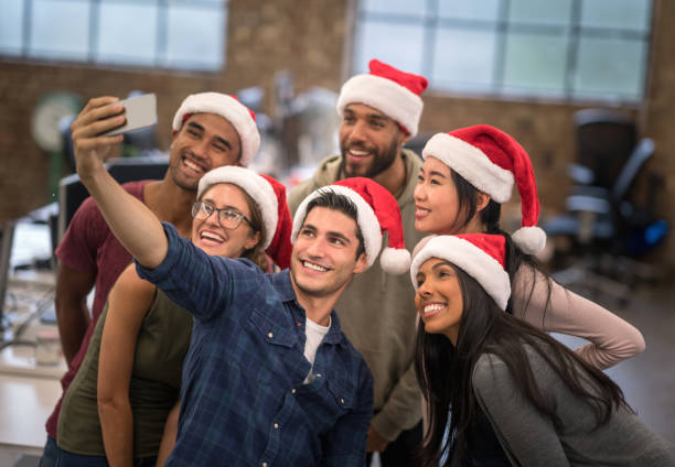 istock People at the office taking a selfie celebrating Christmas 868752868