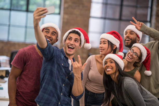 istock Creative office celebrating Christmas and taking a selfie 868752876