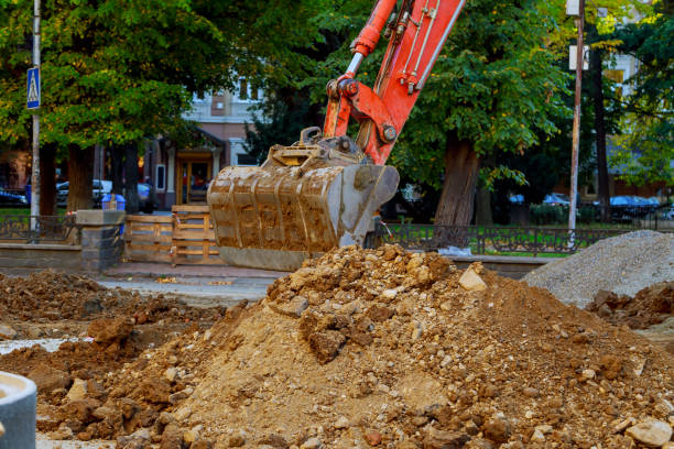 istock excavator who digs the road 868752894
