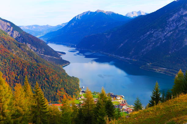 istock Above idyllic Achensee turquoise lake reflection, alpine landscape in Austrian Tirol - Karwendel mountain range border with Bavarian alps in Germany - Majestic alpine landscape in gold colored autumn, dramatic Tyrol Snowcapped mountains panorama, Austria 868752904