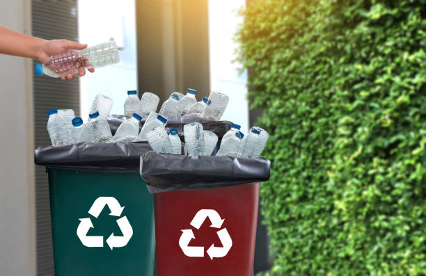 istock man hand putting plastic reuse  for recycling concept environmental protection world recycle 868762524