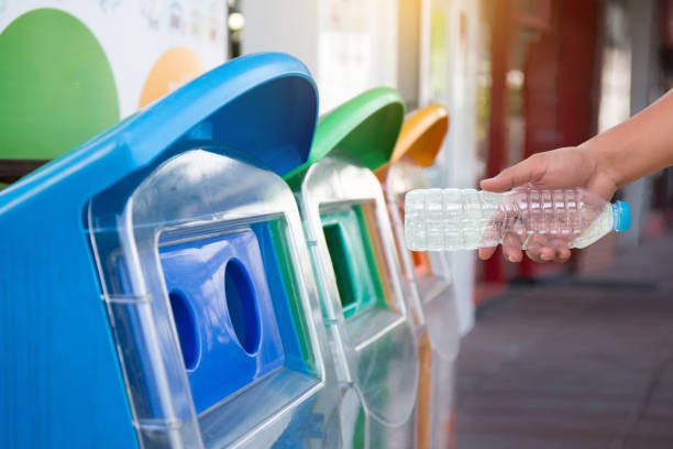 istock man hand putting plastic reuse  for recycling concept environmental protection world recycle 868763006