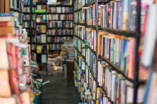 istock Used book shelf in library or bookstore. 868765154