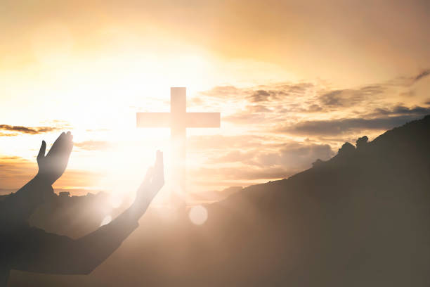 istock Human hands raising hand while praying to jesus 868775520