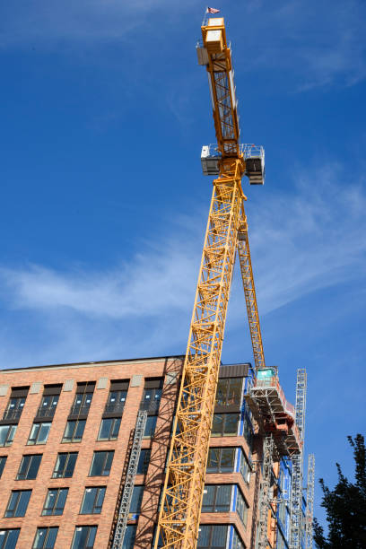 istock New Highrise Building with Crane Overhead 868776120