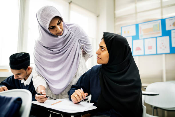 istock diverse muslim children studying in classroom 868776326
