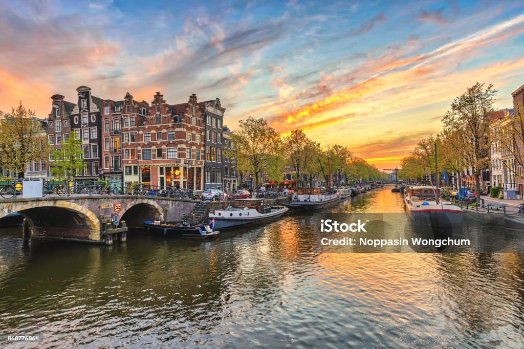 Amsterdam sunset city skyline at canal waterfront, Amsterdam, Netherlands Amsterdam Stock Photo