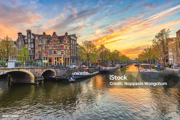 Amsterdam Sunset City Skyline At Canal Waterfront Amsterdam Netherlands Stock Photo - Download Image Now
