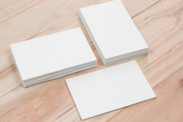 istock White business card on wooden table 868779768