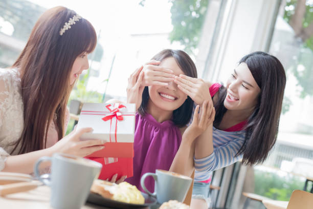 istock happy woman friends in restaurant 868785090