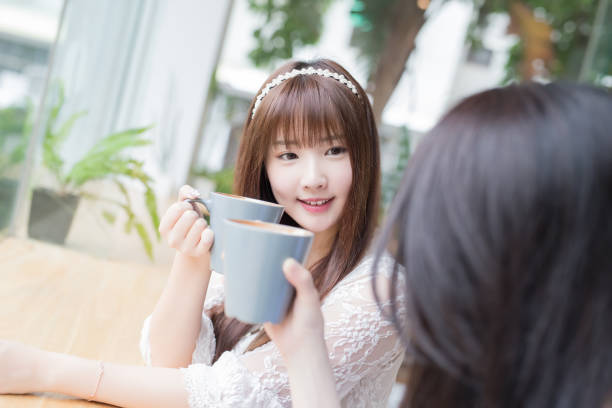 istock happy woman friends in restaurant 868785410