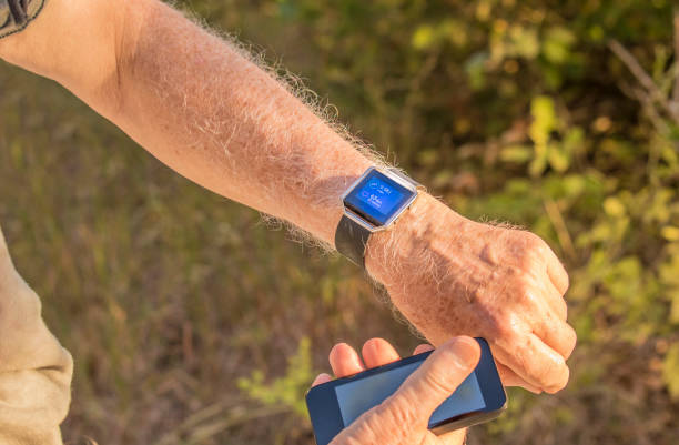 istock Senior man and smart watch 868785536
