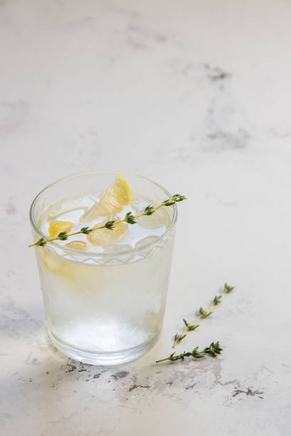 istock Detox water with lemon and thyme in glass, copy space 868788374