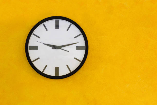 istock Circle Clock On Yellow Wall, Vintage Tone 868792752