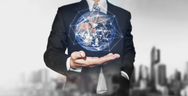 istock Businessman holding globe with network connection on hand. International business, world network connection and environment reservation concept. Elements of this image are furnished by NASA 868795438