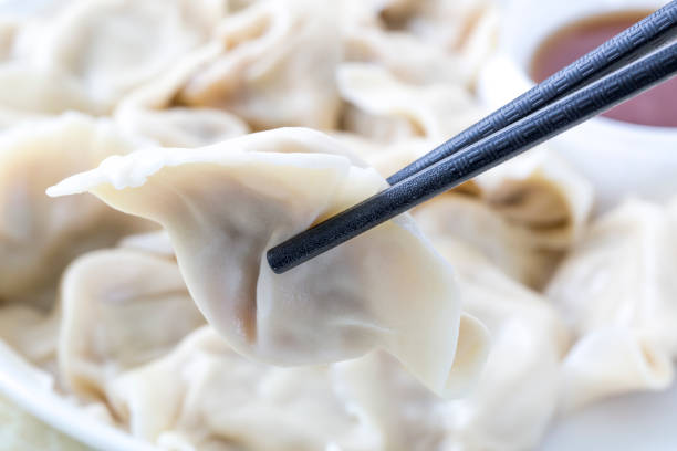 istock Dumpling, Dumpling soup and sauce on white plate. 868796188