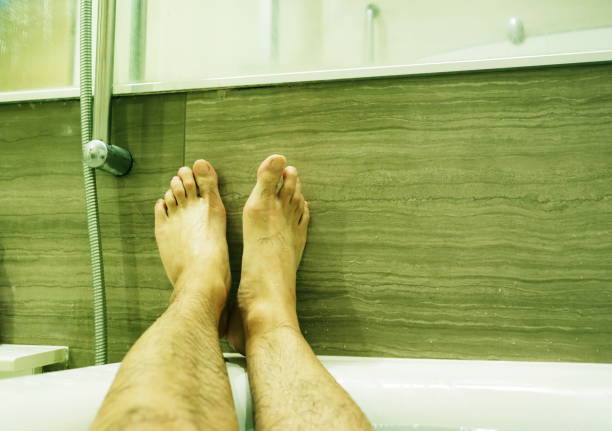 istock Foot of a man in bathtub 868796492
