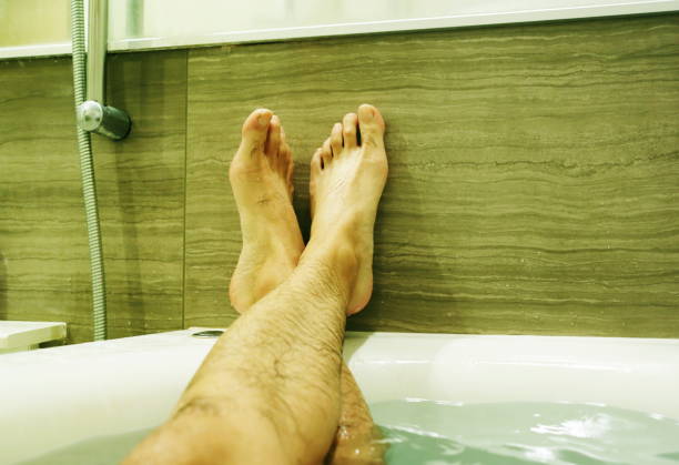 istock Foot of a man in bathtub 868796500