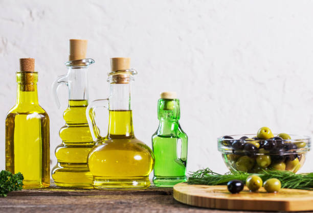 istock Olive oil  on the wooden table 868803352