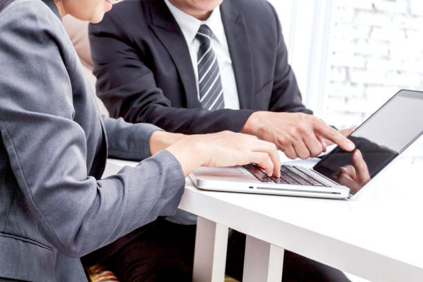 istock Image two business partners working together at office 868803902