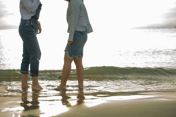 istock Two girls were playing on the beach, it was a beautiful sunset 868805042