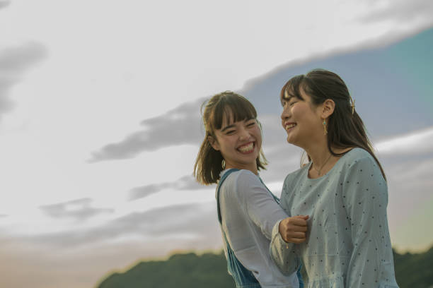istock Two girls were playing on the beach, it was a beautiful sunset 868805046