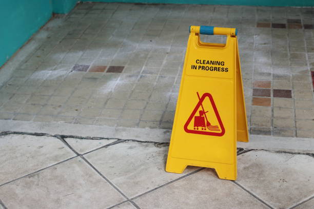 istock Yellow caution cleaning progress sign on the floor outdoors 868807384