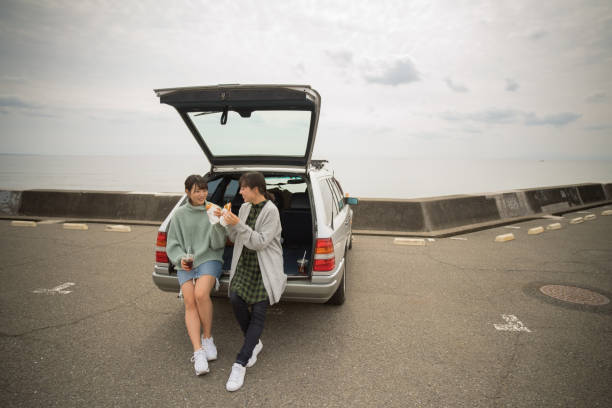 istock They take a sandwich lunch at the beachfront parking lot. . 868808414