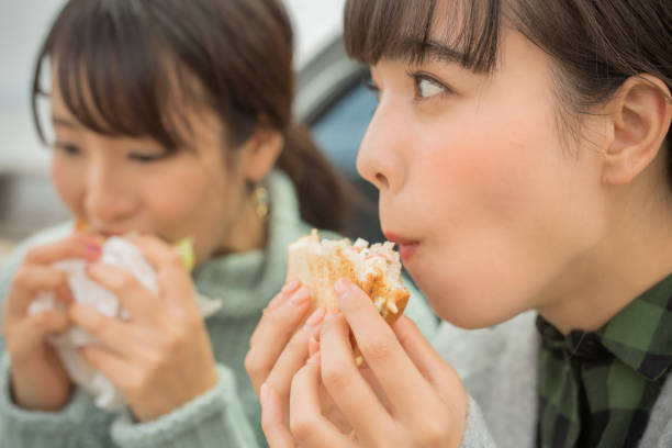 istock They take a sandwich lunch at the beachfront parking lot. . 868808442