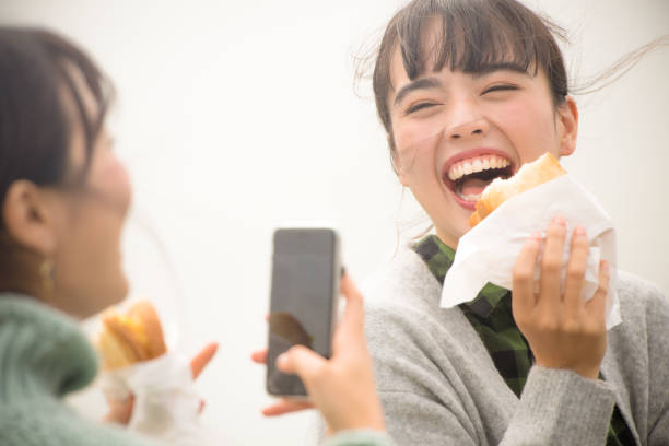 istock They take a sandwich lunch at the beachfront parking lot. . 868808508