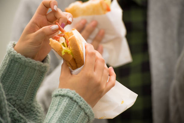 istock They take a sandwich lunch at the beachfront parking lot. . 868808518