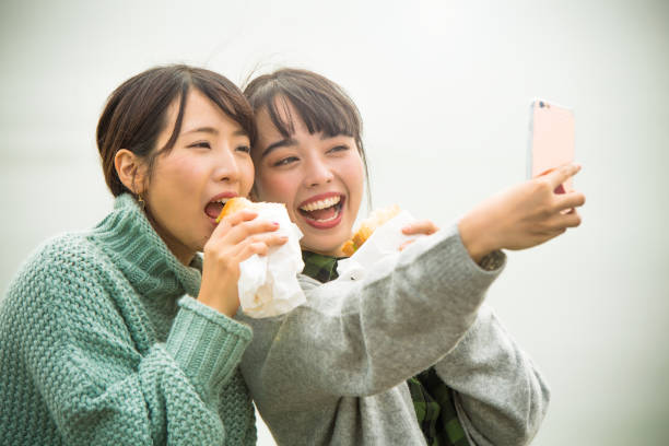 istock They take a sandwich lunch at the beachfront parking lot. . 868808522