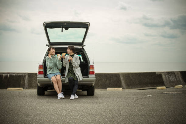istock They take a sandwich lunch at the beachfront parking lot. . 868808538