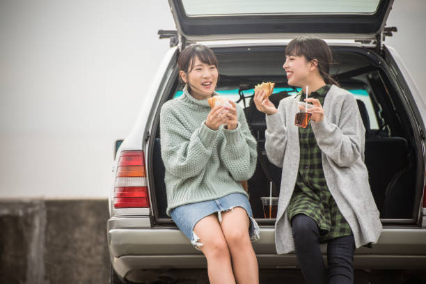 istock They take a sandwich lunch at the beachfront parking lot. . 868808558