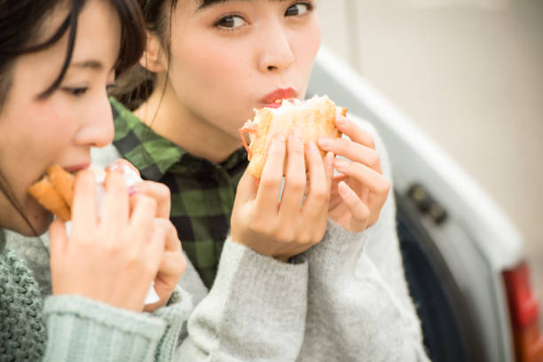 istock They take a sandwich lunch at the beachfront parking lot. . 868808582