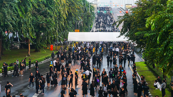 Bangkok ,Thailand - October 26: People walked across Phra Pinklao bridge to visit  The Royal Crematorium of His Majesty King Bhumibol Adulyadej at Sanam Luang