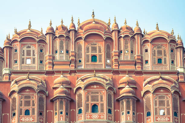 Detail of the Hawa Mahal, Jaipur A detail of the facade of the pink Palace of Winds as seen from the road in the city of Jaipur in eastern Rajasthan, India hawa mahal photos stock pictures, royalty-free photos & images