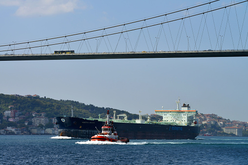 Istanbul, Turkey - August 8: transport on and under Ataturk Bridge (Bosphorus Bridge), August 8, 2013 in Istanbul, Turkey. Ataturk Bridge is a first suspension bridge over the Bosphorus Strait.
