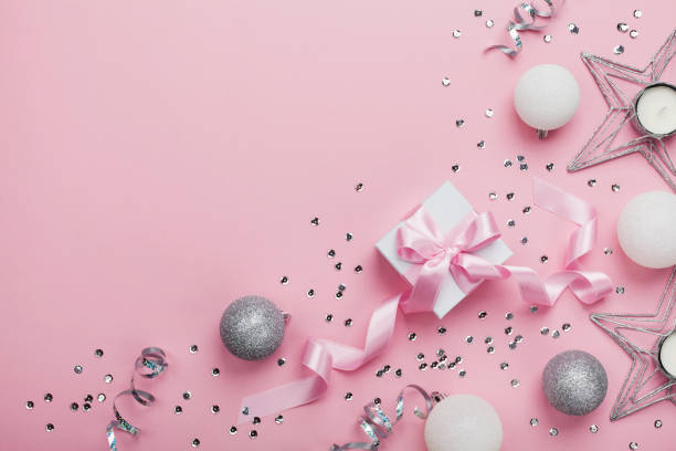istock Christmas decoration and gift box on pink table top view. Flat lay. 868826022