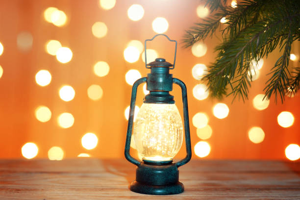 istock New Year greeting card with a luminous flashlight under a Christmas tree 868826900