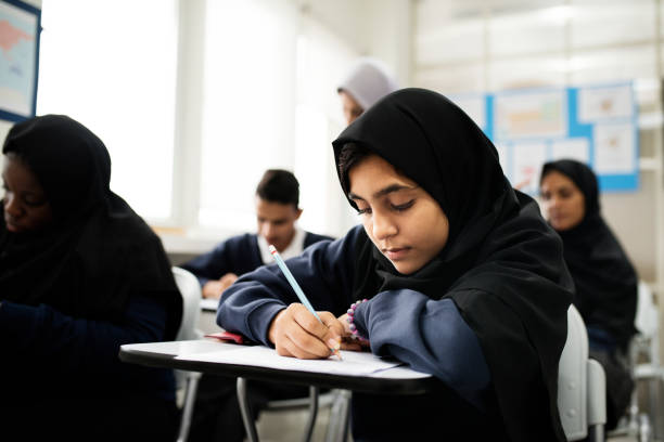 istock diverse muslim children studying in classroom 868834492