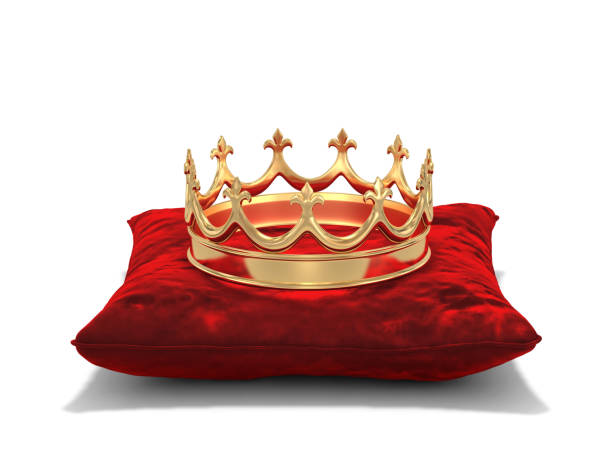 istock Gold crown on red velvet pillow 868837126