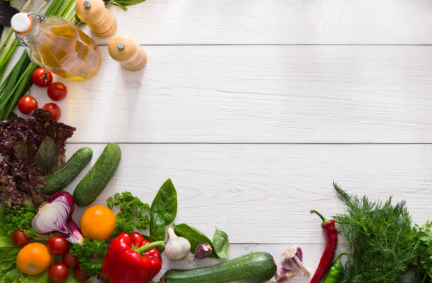istock Fresh vegetables border on white wood background with copy space 868841596