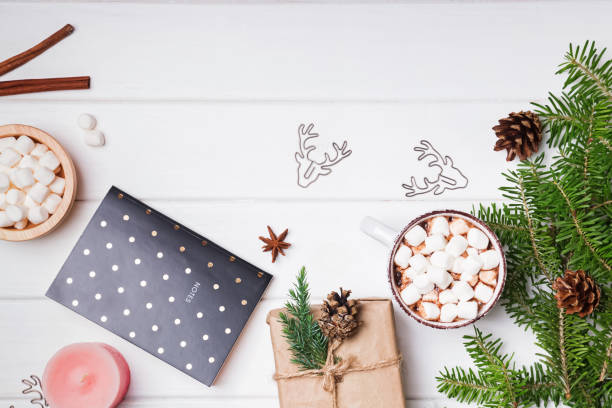 istock Christmas decor, fir branches and hot cocoa with marshamallows 868844434