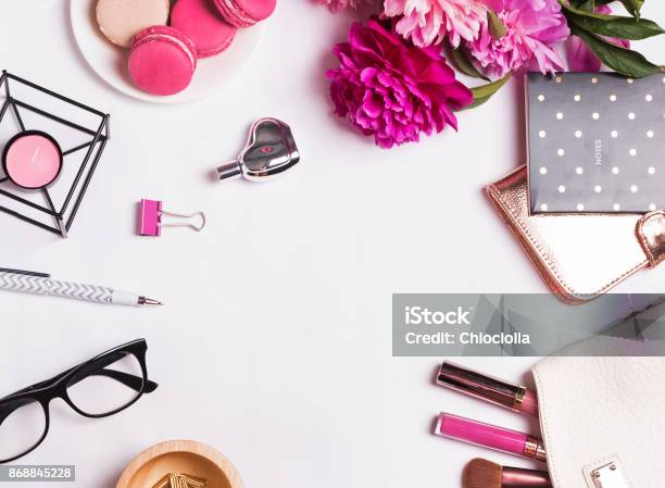 Pink Flowers Macarons Feminine Accessories On The White Stock Photo - Download Image Now