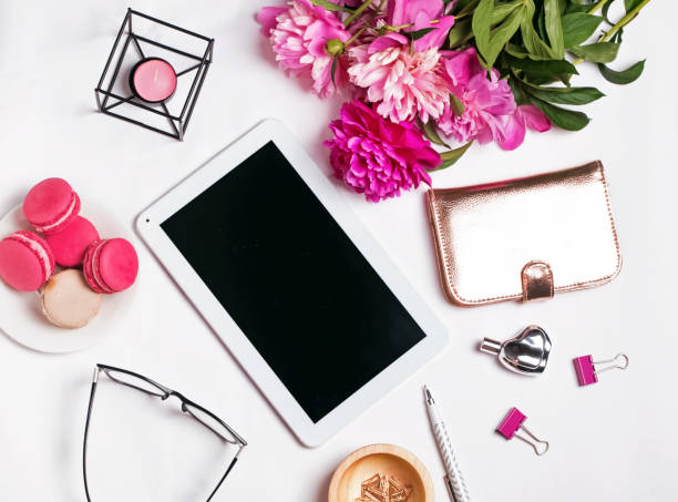 istock Stylish feminine accessories, peonies and tablet with blank screen 868845230