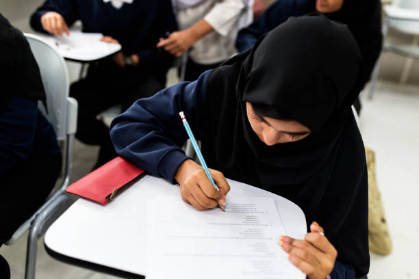 istock diverse muslim children studying in classroom 868847612